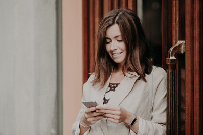 Young woman using mobile phone