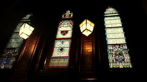 Low angle view of illuminated window in temple