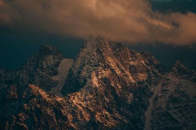 Scenic view of snowcapped mountains against sky during winter