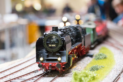 Close-up of toy train on railroad track