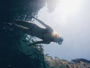 Woman swimming in sea