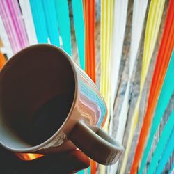 Close-up of coffee cup on book