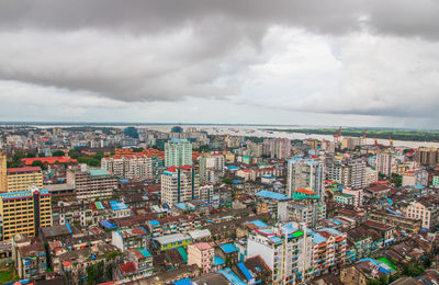 High angle view of buildings against sky in city