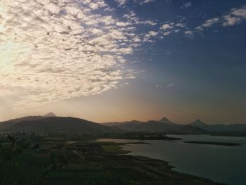 Scenic view of landscape against sky during sunset