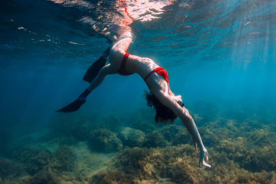 Woman swimming in sea