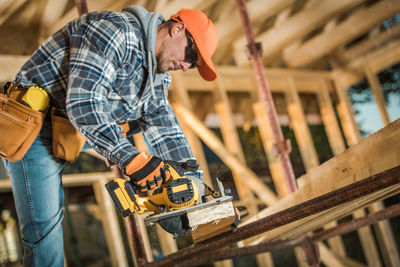 Side view of man working at workshop