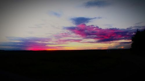 Silhouette landscape against sky during sunset