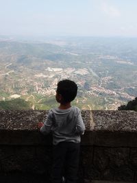 Boy standing at observation point
