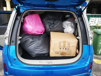 View of garbage in car trunk