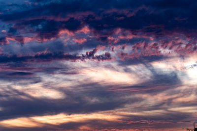 Low angle view of dramatic sky during sunset