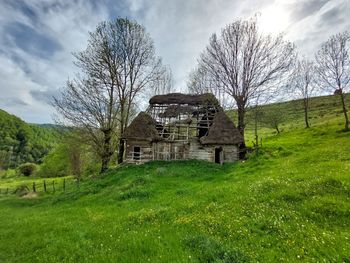 House on field against sky