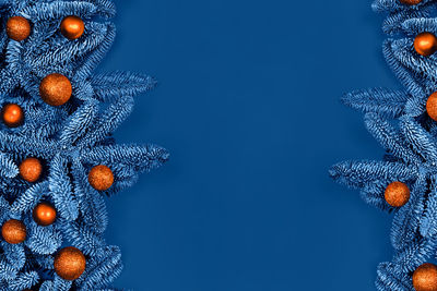Directly above shot of christmas decorations against blue background
