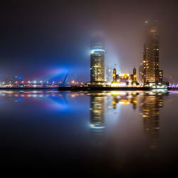 Illuminated buildings in city at night