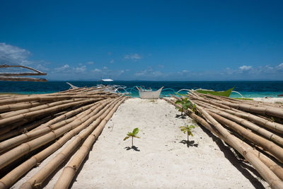 Scenic view of beach against blue sky