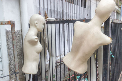 Close-up of statue against white window