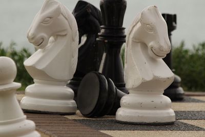 Large chess pieces on footpath