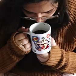 Midsection of woman drinking coffee