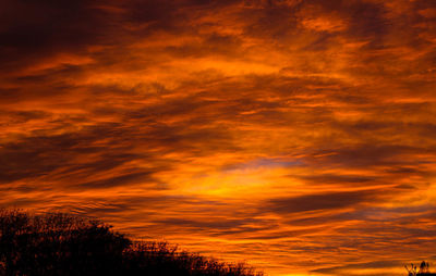 Low angle view of dramatic sky at sunset