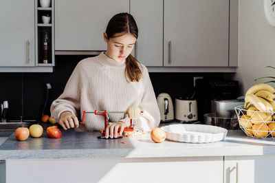 Cute girl preparing food at home