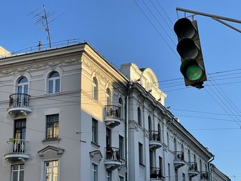 Low angle view of building against blue sky