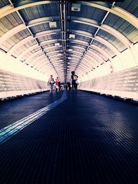 People walking in tunnel