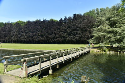 Bridge over canal against sky