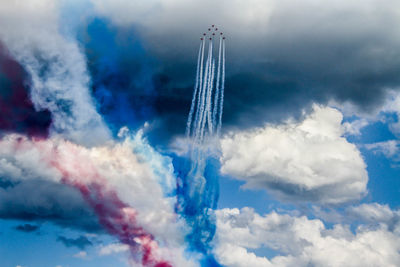 Low angle view of vapor trails in sky