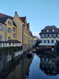 Canal amidst buildings in city