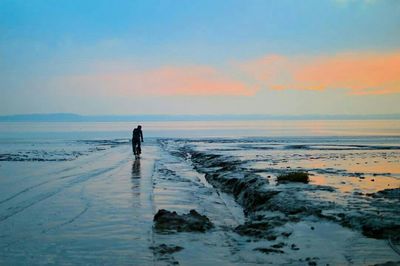 Scenic view of sea at sunset