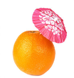 Close-up of orange slice against white background