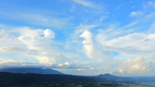 Scenic view of clouds over mountain