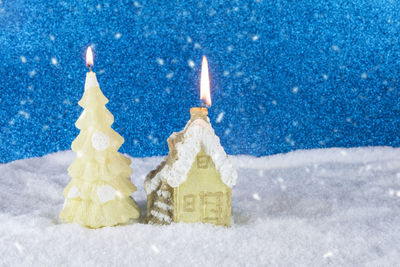 Close-up of christmas decorations on snow