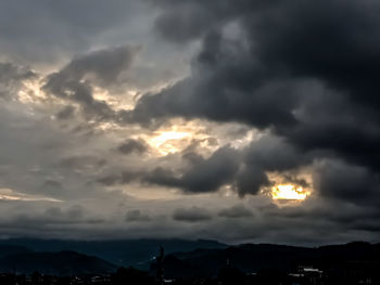 Low angle view of cloudy sky during sunset