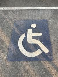 High angle view of arrow symbol on road