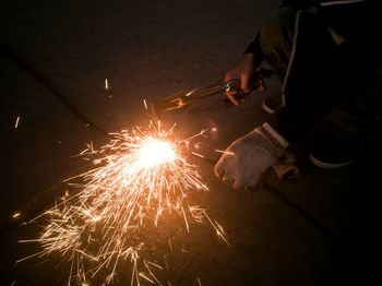 Low angle view of firework display at night