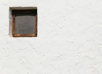 Close-up of window on white wall