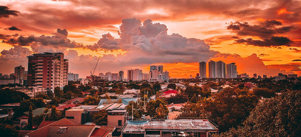 High angle view of buildings against sky during sunset