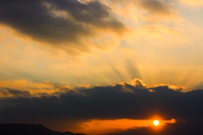 Scenic view of dramatic sky during sunset