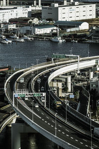 High angle view of highway by buildings in city