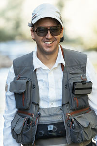 Close-up of man wearing sunglasses standing outdoors