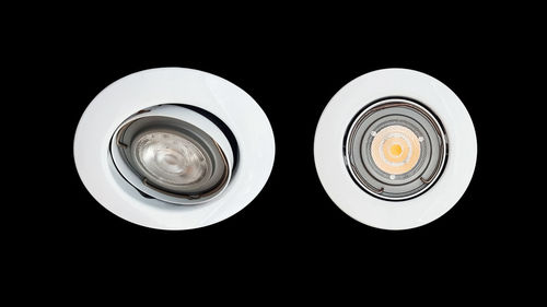 Close-up of illuminated lamp against black background