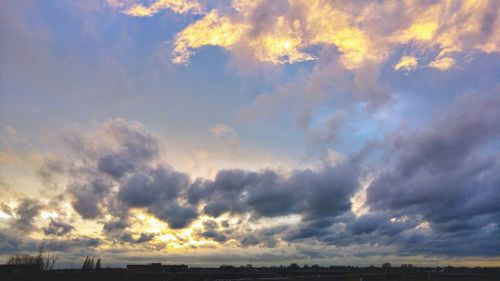 Scenic view of dramatic sky over beach