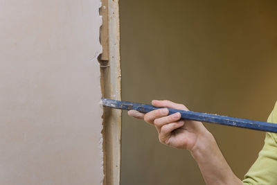 Cropped hand of man repairing equipment