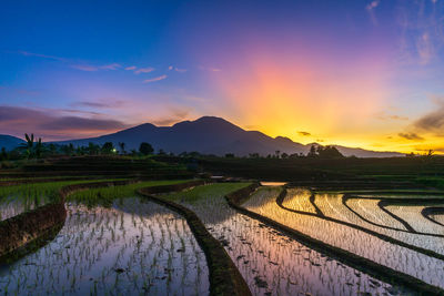 Scenic view of beach against sky during sunset indonesia