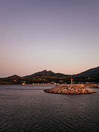 Scenic view of sea against clear sky during sunset