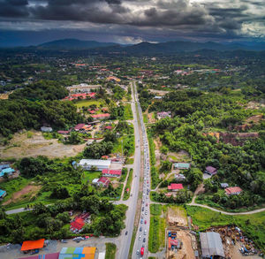 High angle view of trees and buildings in city