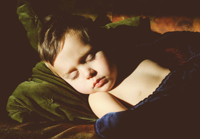 Sweet little boy napping on couch