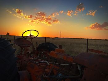 Scenic view of field against sky during sunset