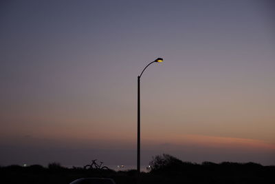 Low angle view of street light against sky at night