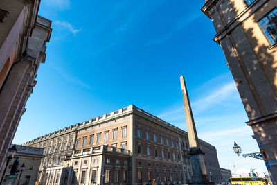 Low angle view of historical building against blue sky